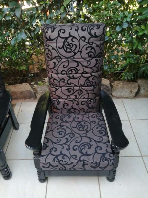 Beautiful pair of black high back arm chairs.