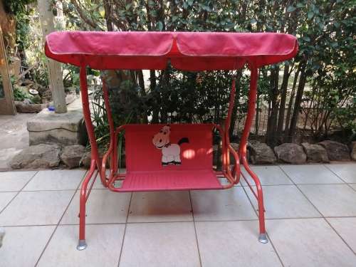 Lovely red toddlers swing.