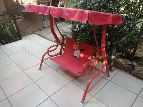 Lovely red toddlers swing.
