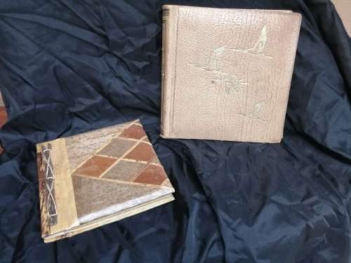 Pair of old parchment scrapbook albums.