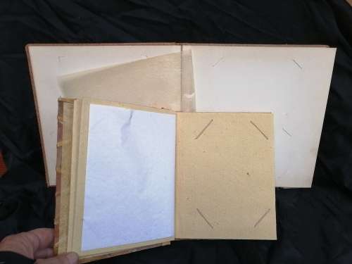 Pair of old parchment scrapbook albums.