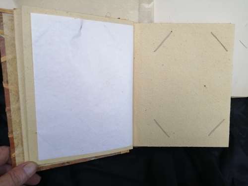 Pair of old parchment scrapbook albums.