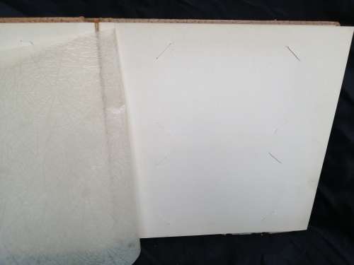Pair of old parchment scrapbook albums.