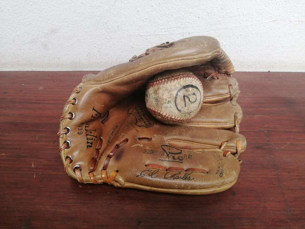 Lovely vintage baseball mitt and ball.