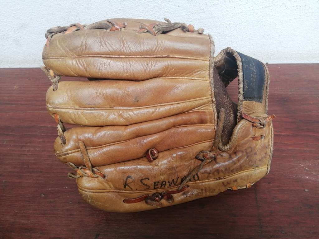 Lovely vintage baseball mitt and ball.
