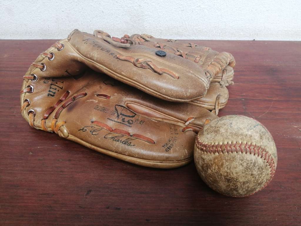 Lovely vintage baseball mitt and ball.