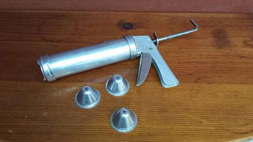 Old metal biscuit maker.