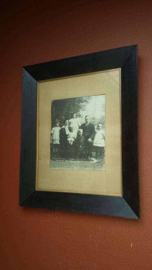 Large, very old framed family photo.