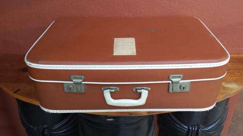 Medium old brown suitcase.