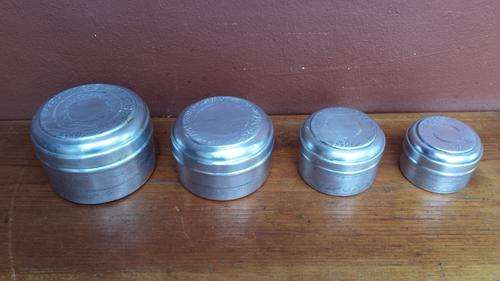 Set of 4 old aluminium tins.