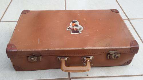 Old medium size brown suitcase.
