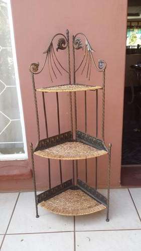 Beautiful metal and cane corner stand.
