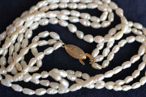 TRIPLE STRAND OF FRESH WATER PEARLS