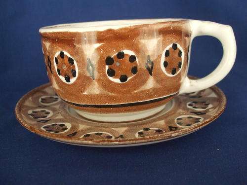 Pottery Cup and Saucer
