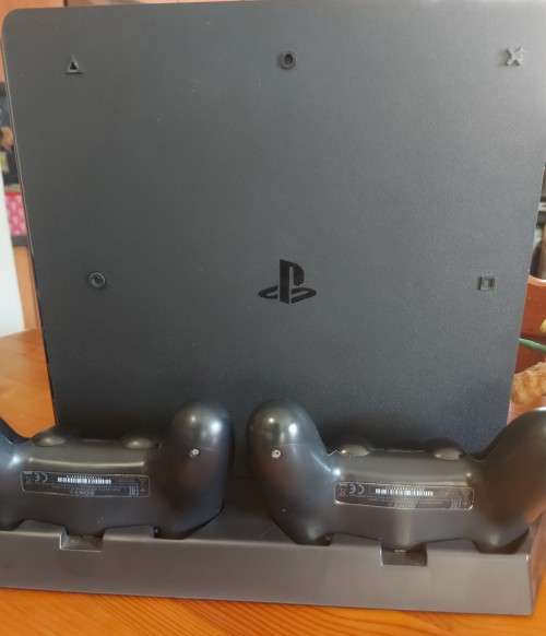 PlayStation 4 slim 500GB bundle with two controllers and six games , excellent condition