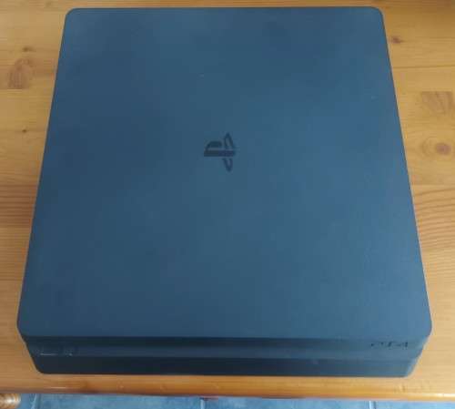 PlayStation 4 slim 500GB bundle with two controllers and six games , excellent condition