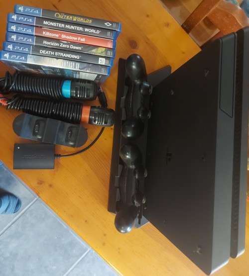 PlayStation 4 slim 500GB bundle with two controllers and six games , excellent condition