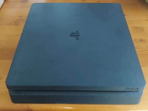 PlayStation 4 slim 500GB bundle with two controllers and six games , excellent condition