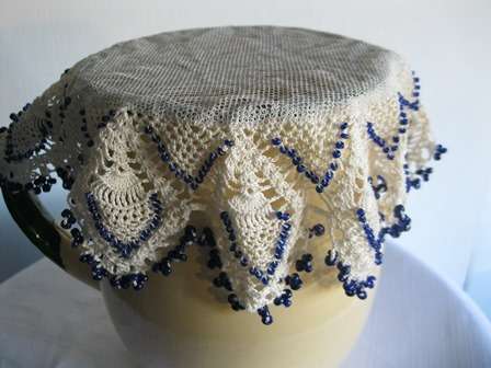 Vintage Beaded Milk Cosie with  Navy Beads