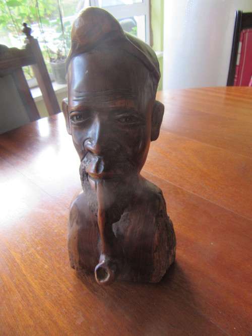 Beautifully Carved Wooden Bust with a Male Smoking a Pipe