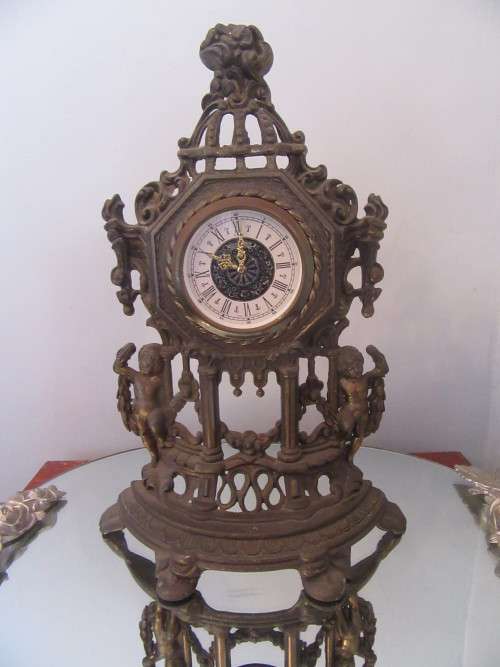 Ornate Brass Mantel  Clock with Cherubs.