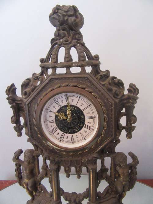 Ornate Brass Mantel  Clock with Cherubs.