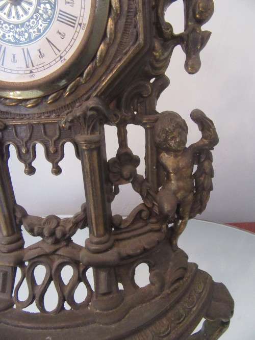 Ornate Brass Mantel  Clock with Cherubs.