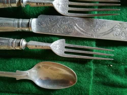 Set of 8 knives and forks with 4 spoons.