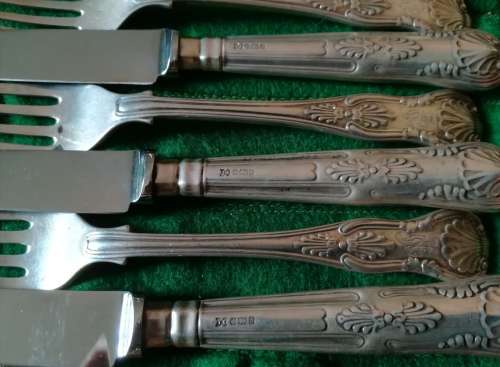 Sterling set of 12 knives and forks
