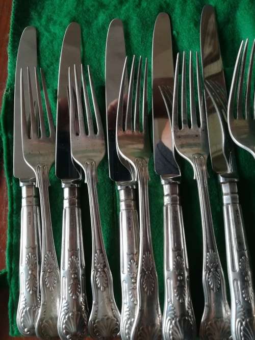 Sterling set of 12 knives and forks