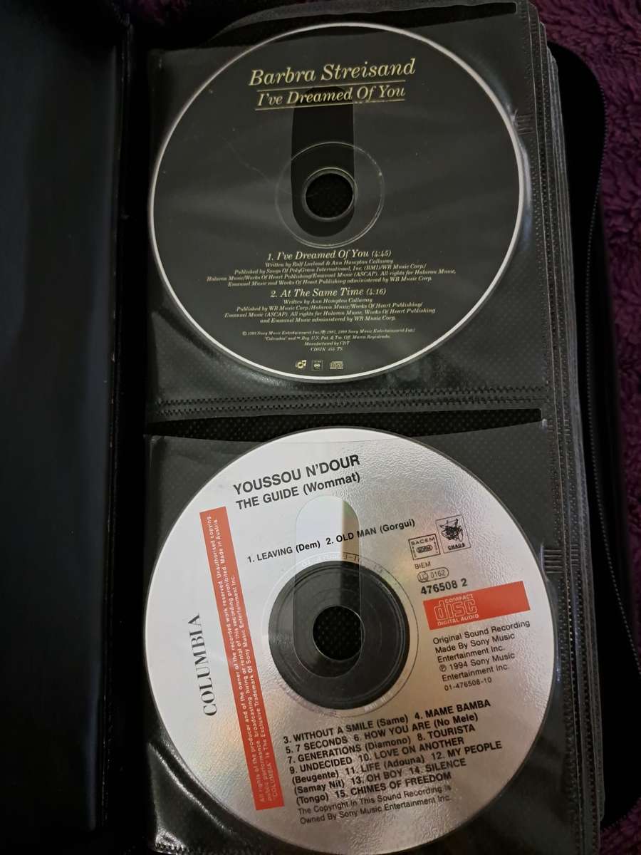 Music CDS. WITH POUCH ABOUT 60CDS MUSIC MUSIC