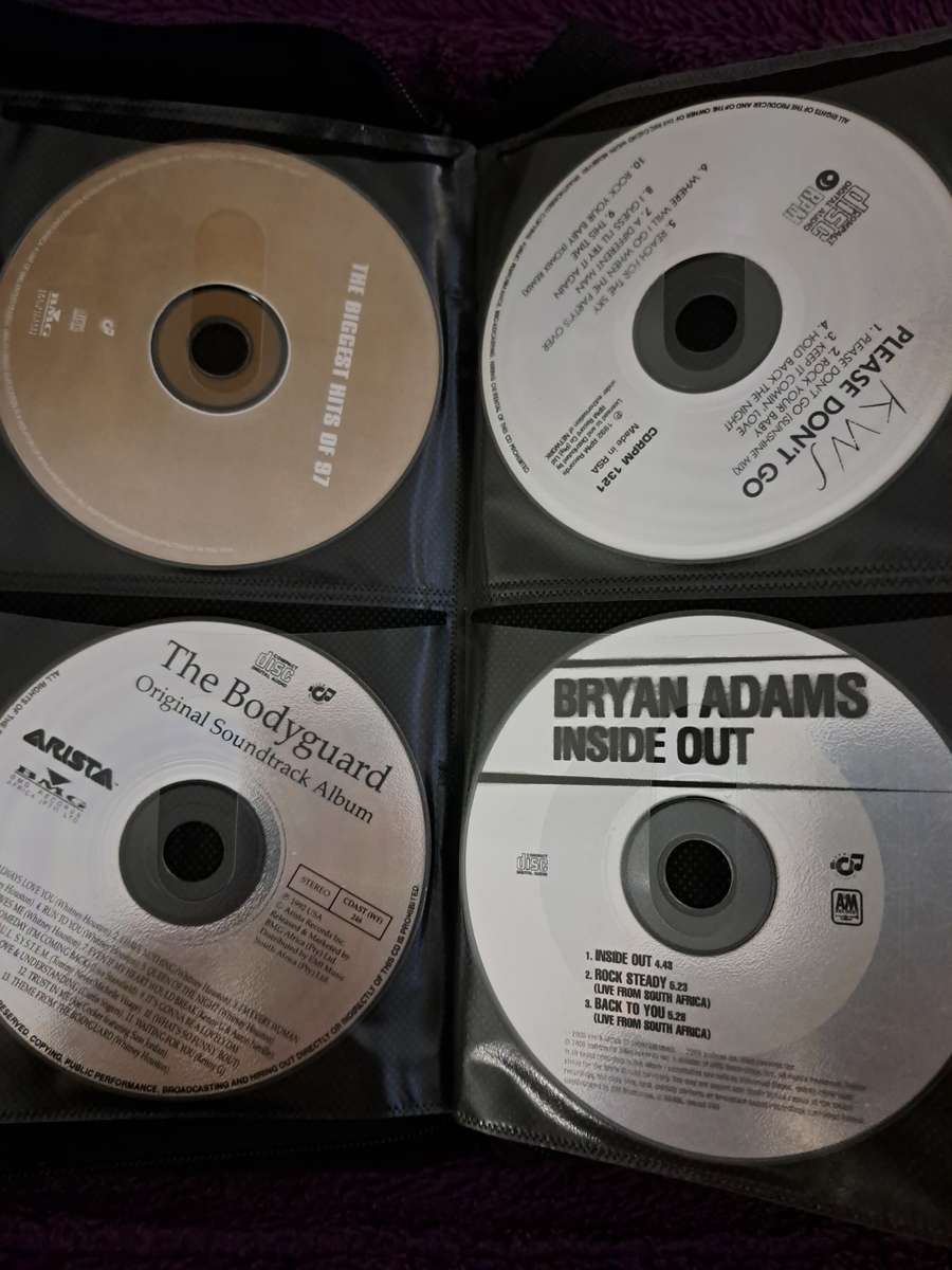 Music CDS. WITH POUCH ABOUT 60CDS MUSIC MUSIC