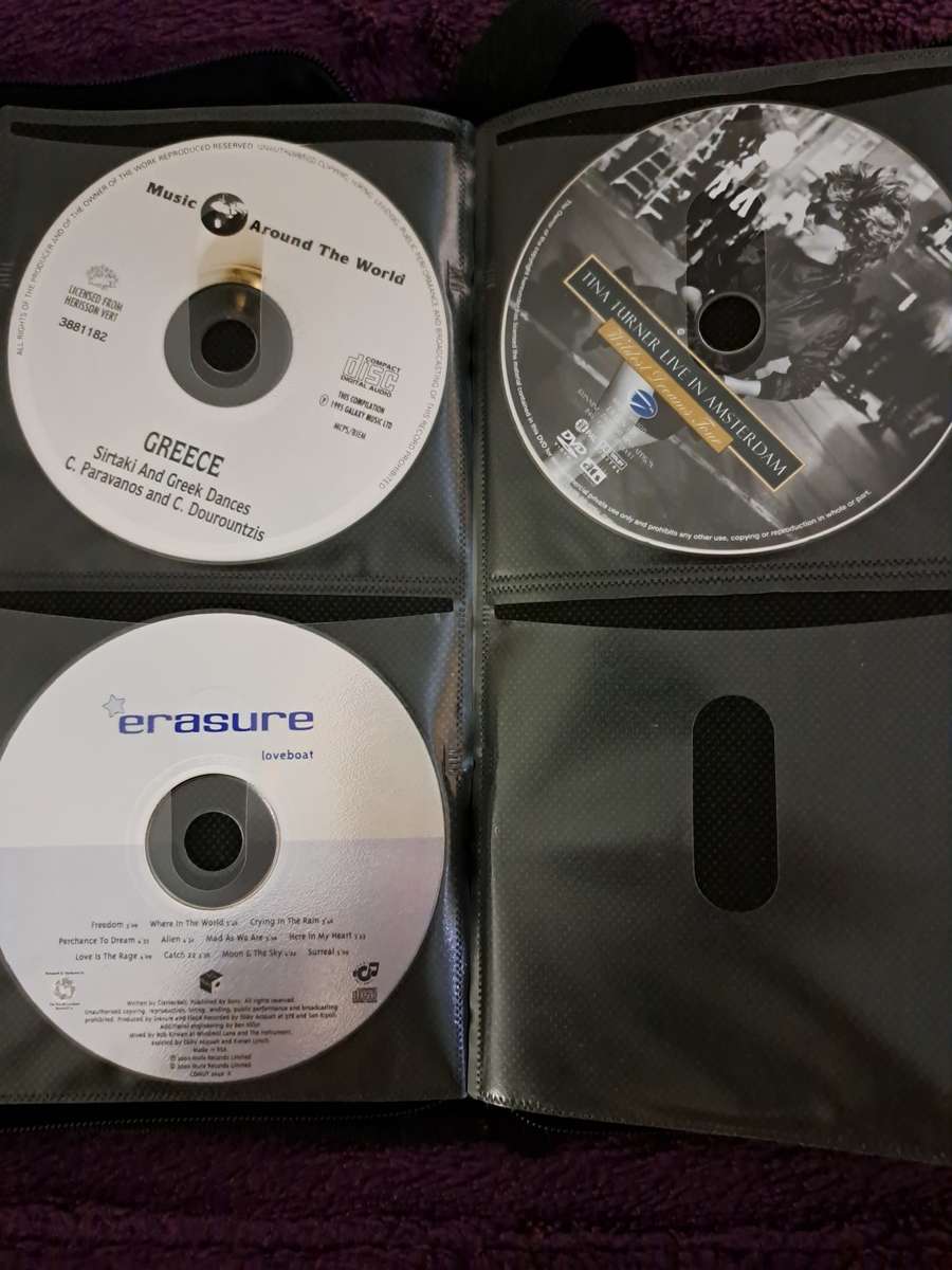 Music CDS. WITH POUCH ABOUT 60CDS MUSIC MUSIC