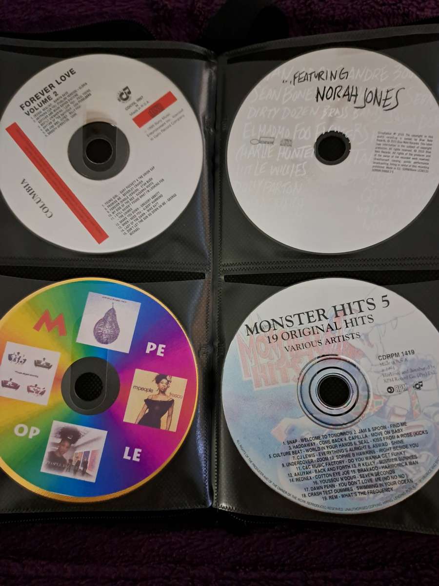 Music CDS. WITH POUCH ABOUT 60CDS MUSIC MUSIC