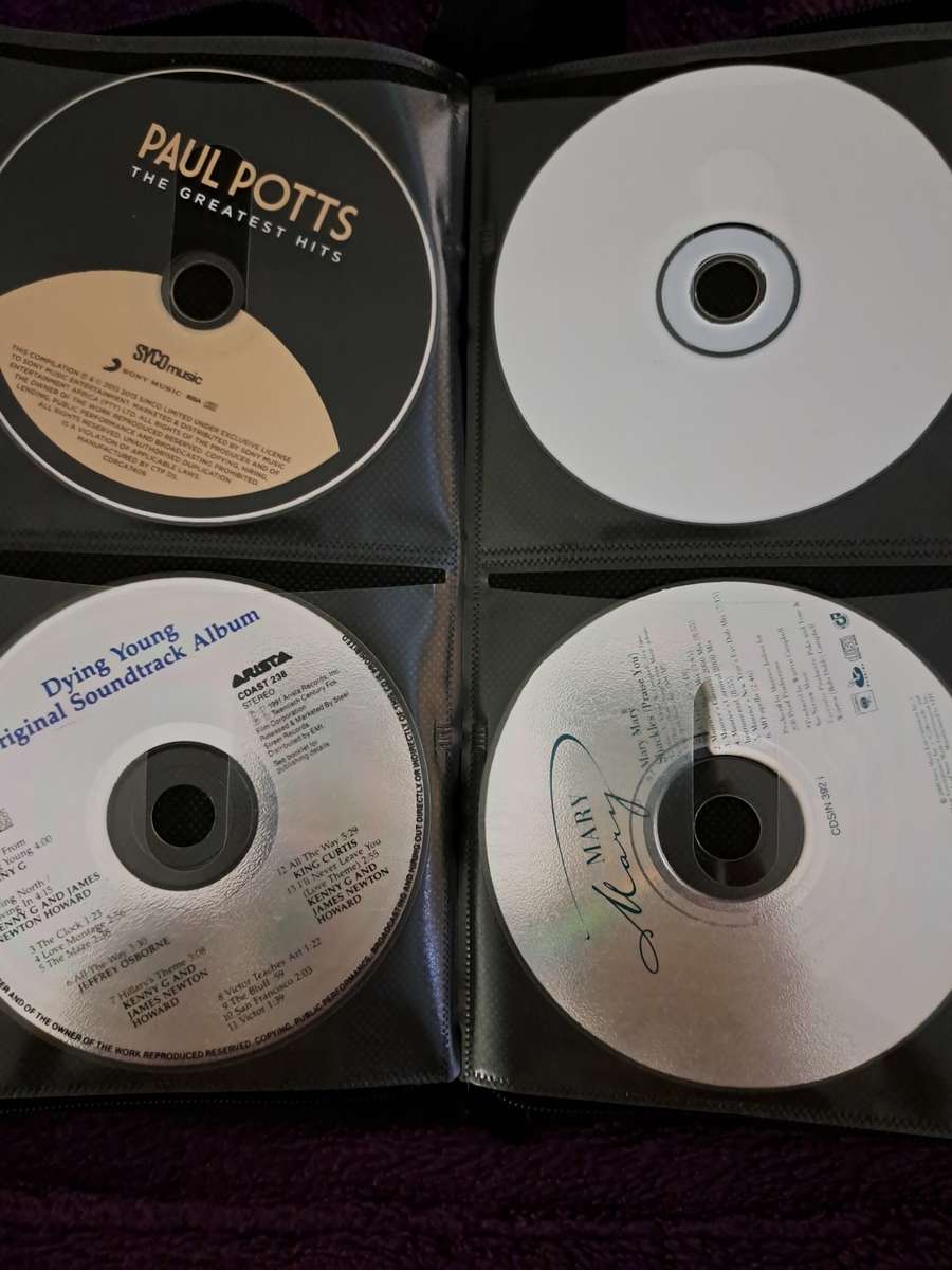 Music CDS. WITH POUCH ABOUT 60CDS MUSIC MUSIC