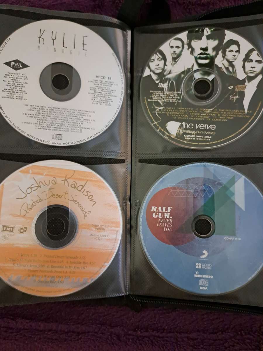 Music CDS. WITH POUCH ABOUT 60CDS MUSIC MUSIC