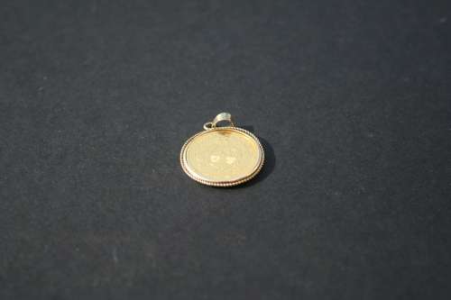 1895 1 POND IN GOLD PENDANT