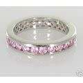Silver ring with simulated pink zirconias in an eternity ring design