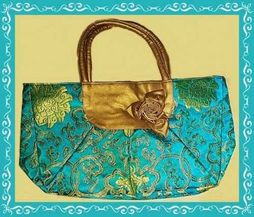 Soft handle bag with bow for day or evening wear