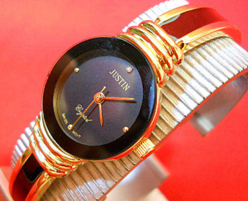 -LADIES GOLD AND BLACK COLORED METAL WATCH-