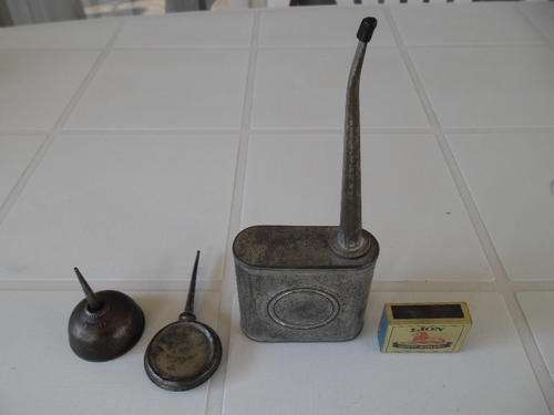 Three vintage metal oil cans