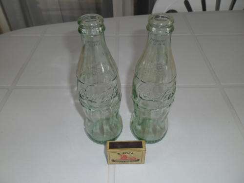 two small 250ml coca cola bottles