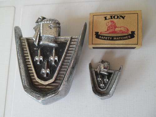 two old car badges
