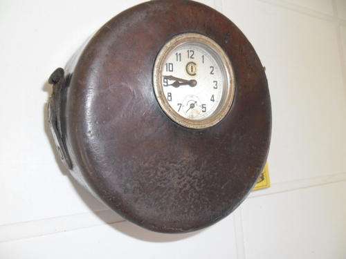 old clock in leather case size is 140mm wide no key and don't no if it works