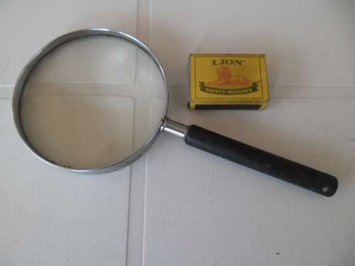 Well used large magnified glass size is 220mm long over handle postage is R60