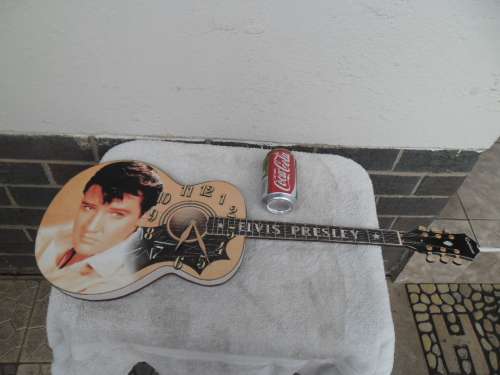Large Elvis Presley guitar clock not working need new clock size is 755mm long postage is R95