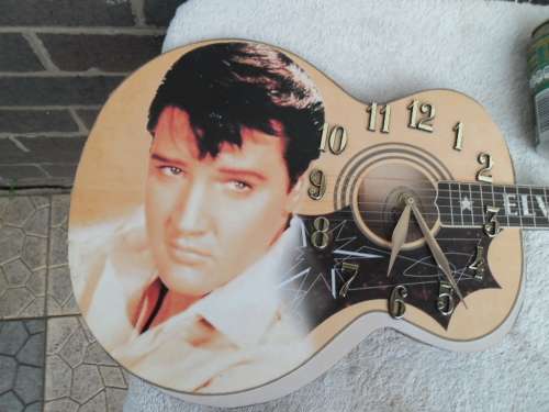 Large Elvis Presley guitar clock not working need new clock size is 755mm long postage is R95