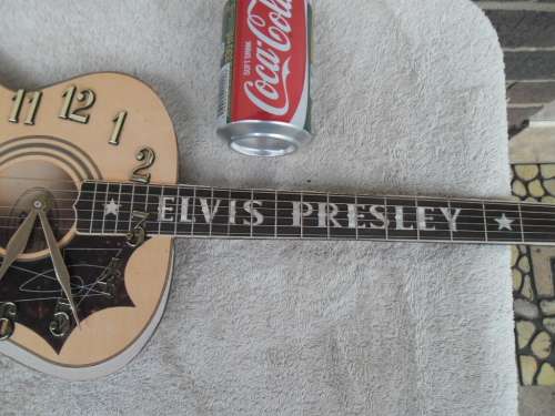 Large Elvis Presley guitar clock not working need new clock size is 755mm long postage is R95