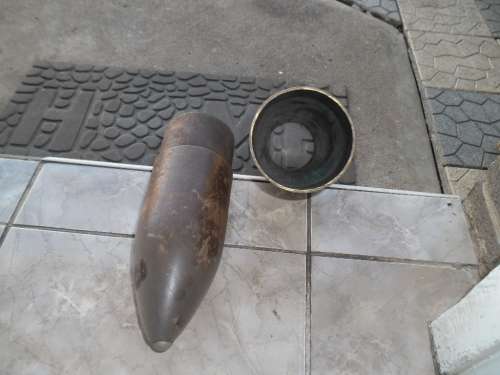 Brass and wood bullet shape display item size is 660mm long postnet postage R140