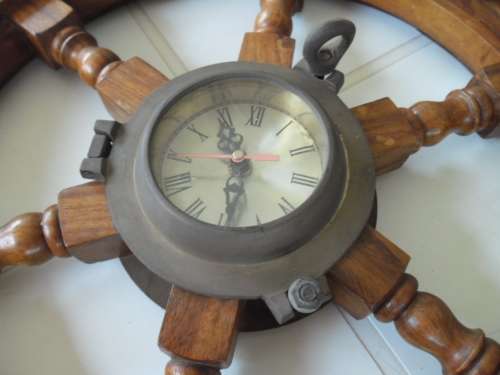 Center brass Porthole with clock working and wood ships wheel add to your order postnet postage R220